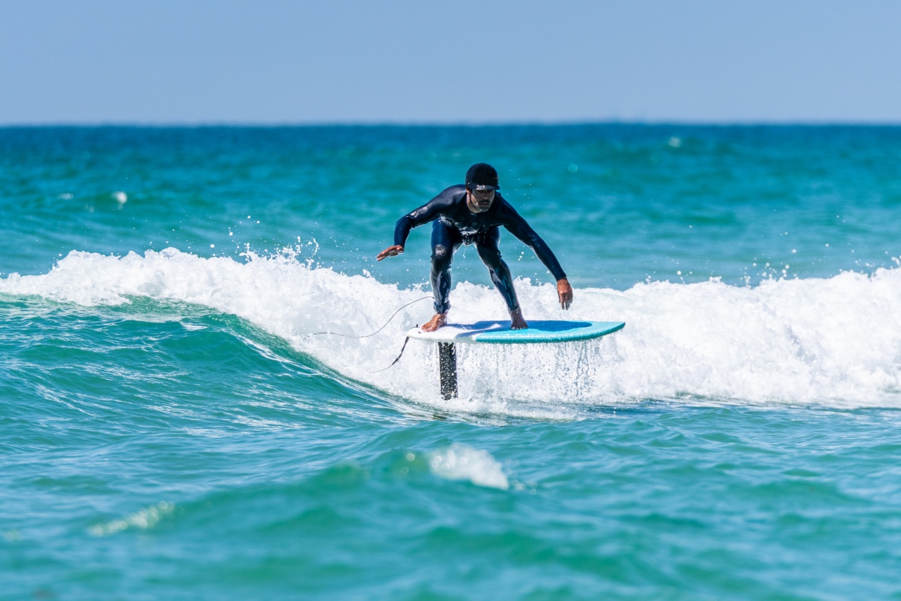 Surf foiler riding a wave